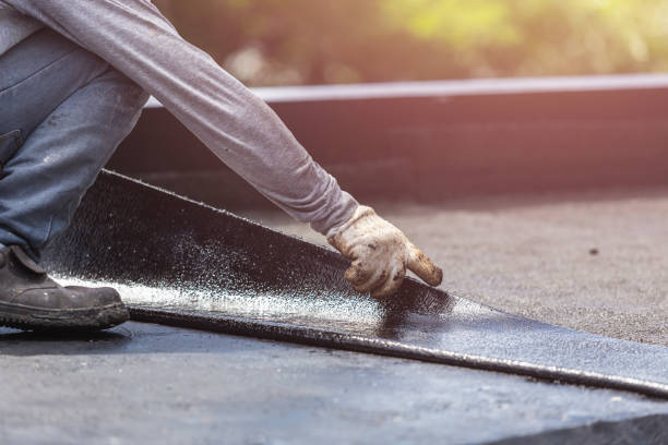 Professional Basement Waterproofing technician working in Aston, PA